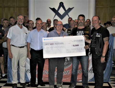Gary Brodie and Dan Cunningham handing over a cheque for £10,000 to Graham Dearing, Phil Blacklaw and Tony Robinson